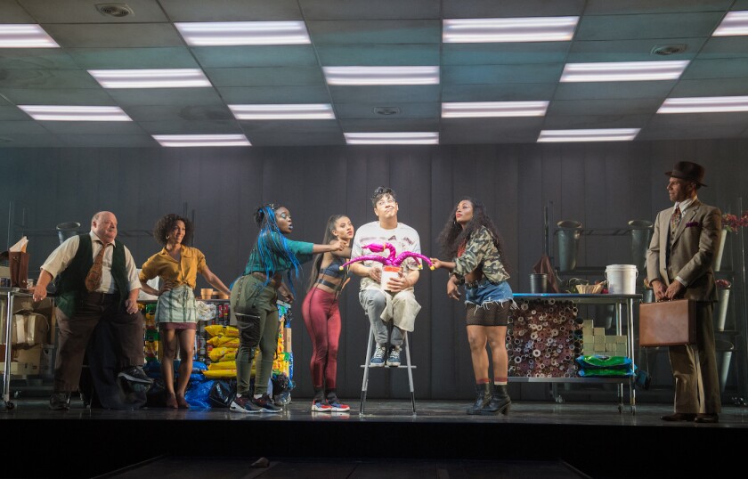 George Salazar as Seymour, with carnivorous plant at the center of Pasadena Playhouse’s “Little Shop of Horrors.”