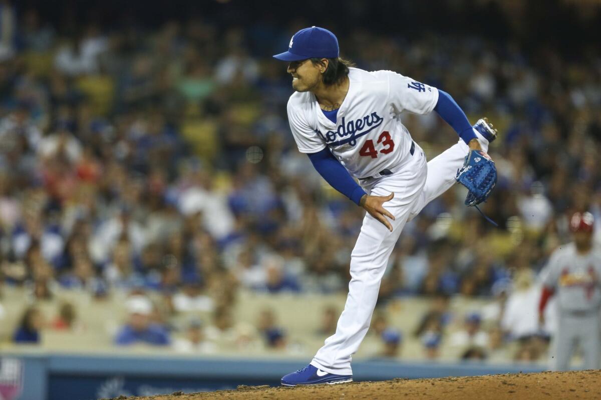 Brandon League pitches during the seventh inning against the St. Louis Cardinals. League has given up just two hits in his last five relief appearances for the Dodgers.