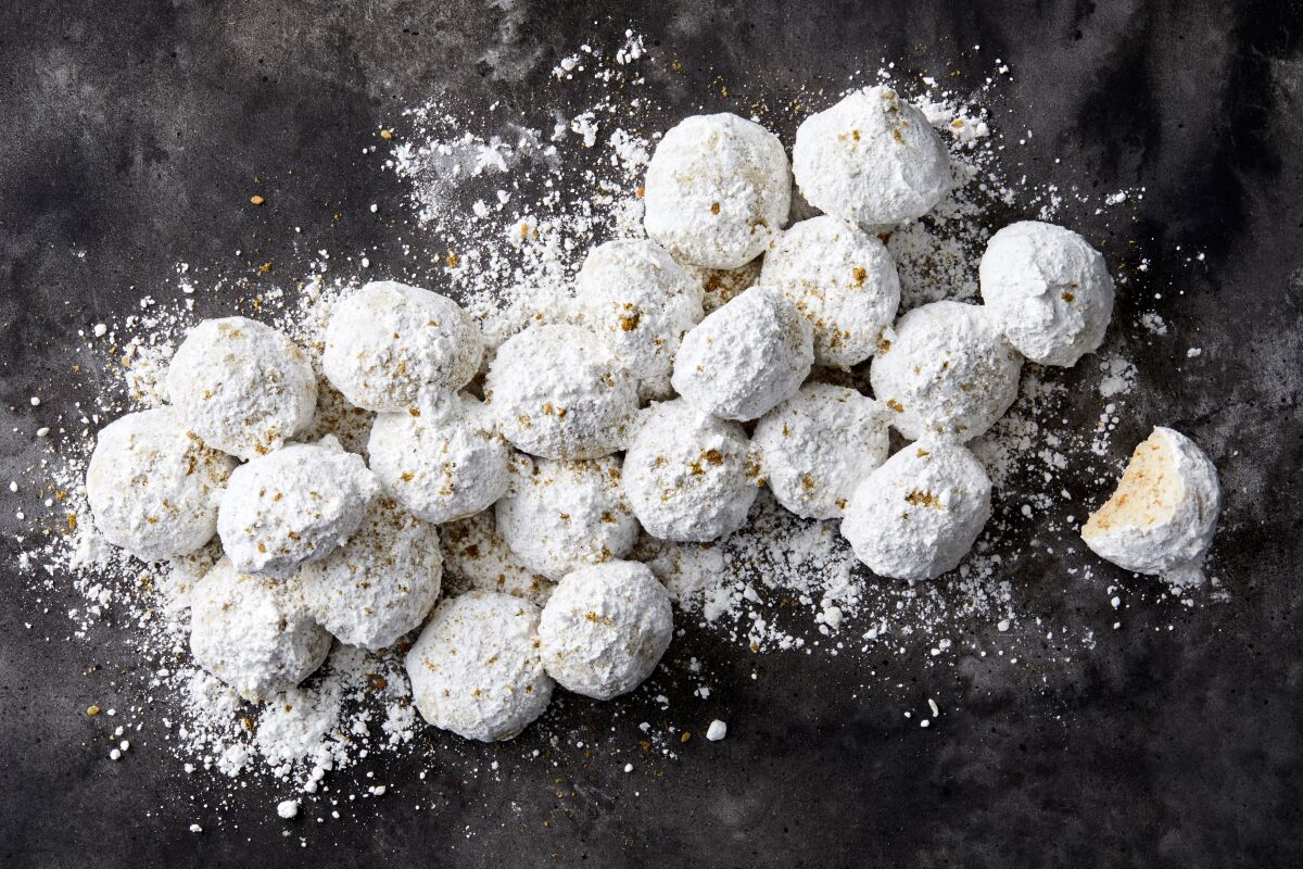 Za’atar, the dried herb spice mix used in savory Middle Eastern cooking, shines in these lightly-sweetened, crumbly wedding cookies, coated in snowy powdered sugar.