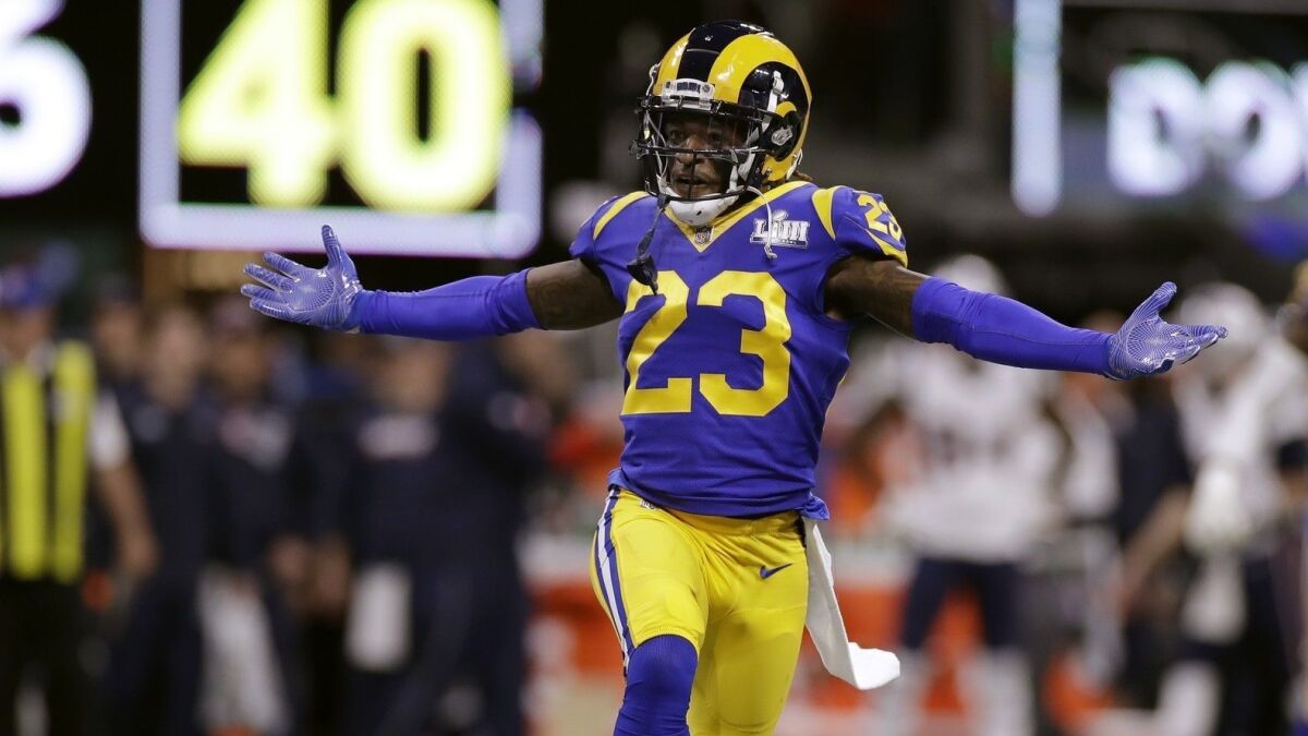 Rams cornerback Nickell Robey-Coleman celebrates after an interception by teammate Cory Littleton on Patriots quarterback Tom Brady in the first quarter.