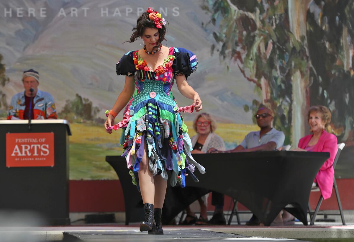 Artist Elizabeth McGhee models her own dress creation made from socks at the Festival of Arts runway fashion show.