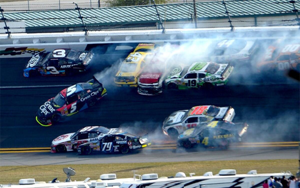 Michael Annett, in the yellow car, was injured in a multiple-car crash late in the race.