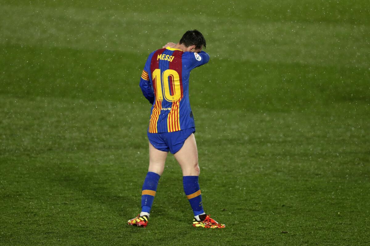 Barcelona's Lionel Messi stands at the pitch during the Spanish La Liga soccer match between Real Madrid and FC Barcelona at the Alfredo di Stefano stadium in Madrid, Spain, Saturday, April 10, 2021. Real Madrid won 2-1. (AP Photo/Manu Fernandez)