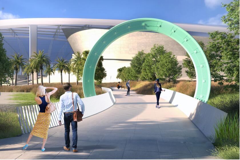 A rendering shows a circular architectonic structure in sea foam green on a pedestrian bridge before SoFi  Stadium