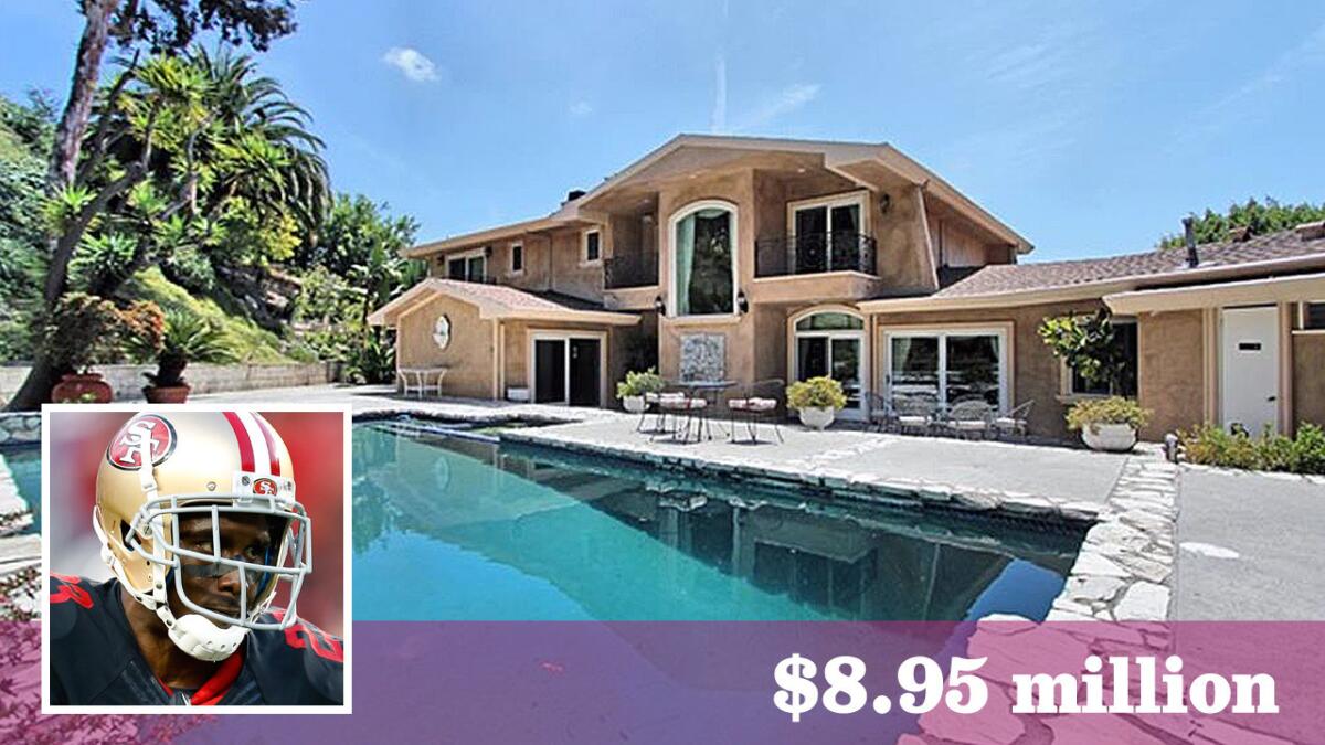 A group of athlete investors, including NFL tailback Reggie Bush, has paid $8.95 million for a home on more than half an acre in Beverly Hills.