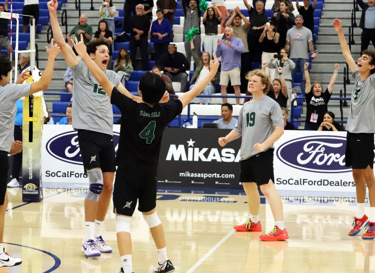 The Sage Hill boys' volleyball team celebrates after scoring to win the CIF Southern Section Division 5 championship.