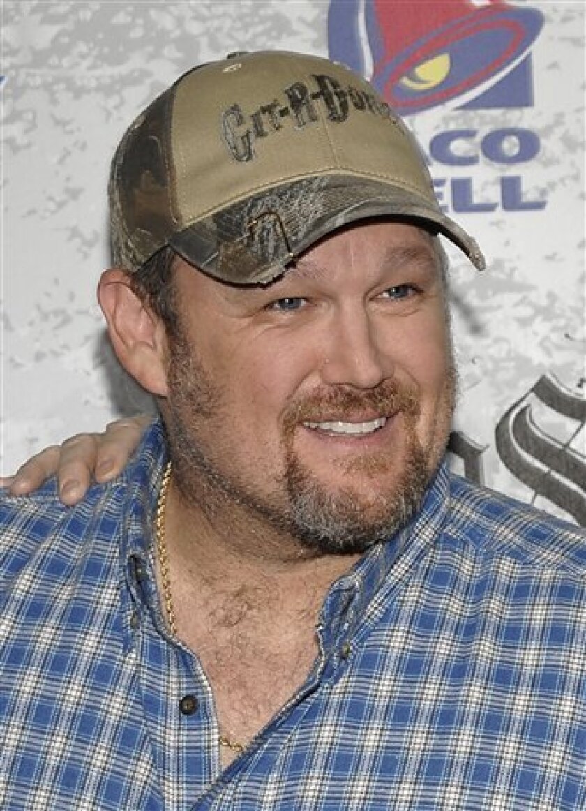 In this March 1, 2009 file photo, comedian Dan Whitney, also known as Larry the Cable Guy, arrives at Comedy Central Roast of Larry the Cable Guy at the Warner Bros. studio lot in Burbank, Calif. (AP Photo/Dan Steinberg, file)