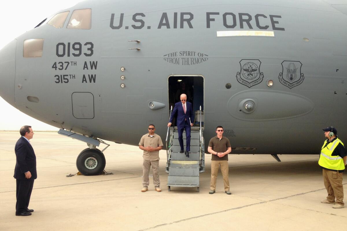 Vice President Joe Biden steps off a C-17 military transport plane, the Spirit of Strom Thurmond, upon his arrival in Baghdad on Thursday.
