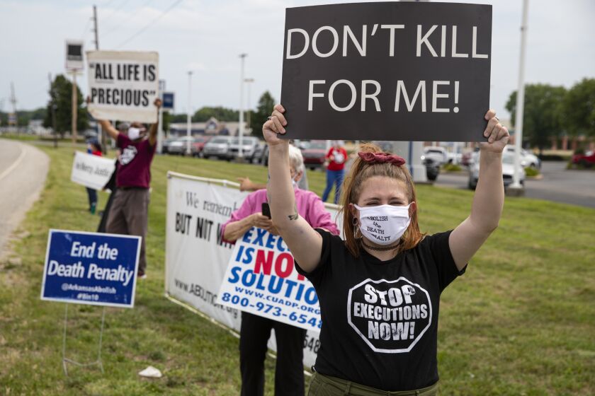 Protesters against the death penalty gather in Terre Haute, Ind., Wednesday, July 15, 2020. Wesley Ira Purkey, convicted of a gruesome 1998 kidnapping and killing, is scheduled to be executed Wednesday evening at the federal prison in Terre Haute. (AP Photo/Michael Conroy)