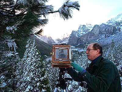 Marvin Roos of Palm Springs frames Yosemite Valley in a wood 4-by-5 camera at Tunnel View, where many visitors get their first glimpse of the national park's splendor in white.