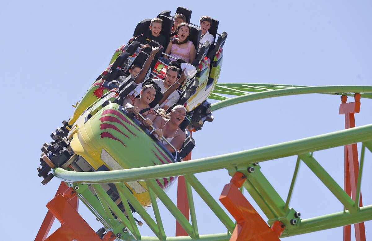 Riders on the Raptor rollercoaster scream on opening day of the 2023 Orange County Fair in Costa Mesa in July. 