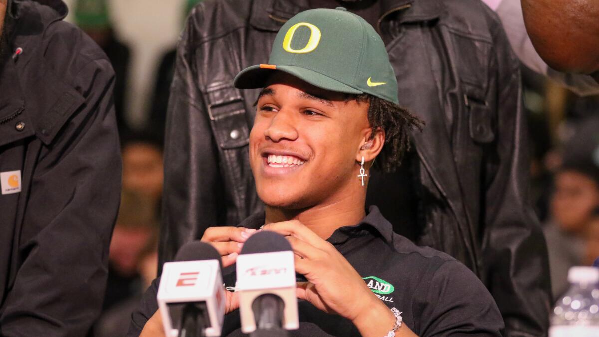 Upland linebacker Justin Flowe smiles after announcing his commitment to Oregon.
