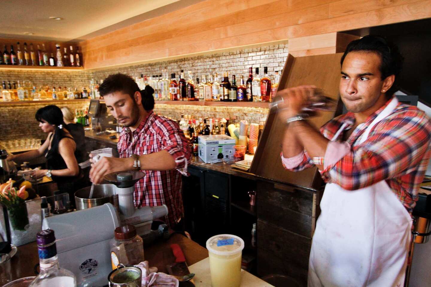 Julian Cox, left, Deysi Alvarez and Shane Croughan prep the bar at Picca restaurant.