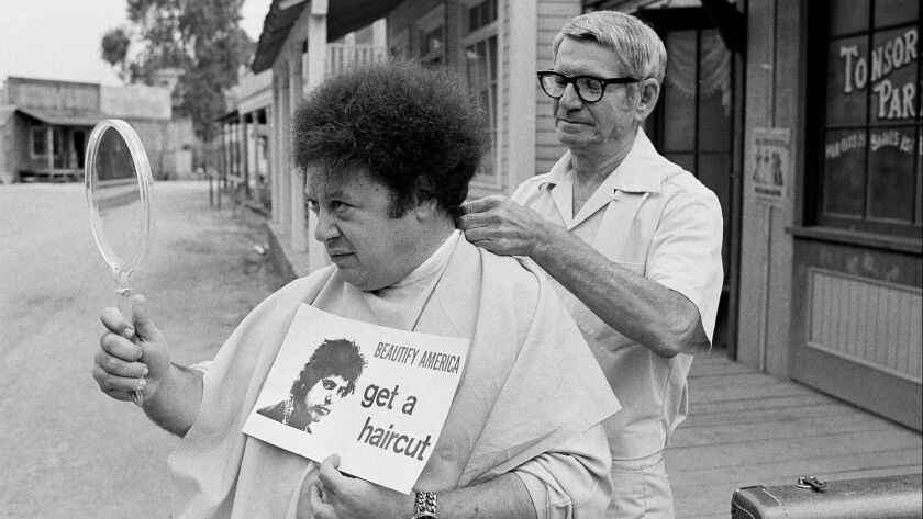 Always up for a gag, Marty Allen has his hair styled by barber Sol Goldstein in Hollywood in 1968.