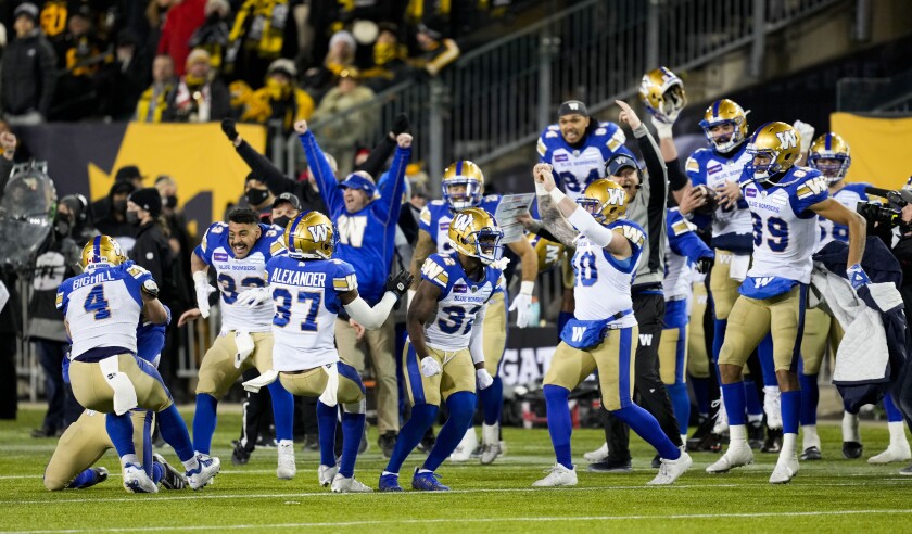 The Winnipeg Blue Bombers celebrate their victory against the Hamilton Tiger-Cats in the CFL Grey Cup football game, Sunday, Dec. 12, 2021 in Hamilton, Ontario. (Ryan Remiorz/The Canadian Press via AP)