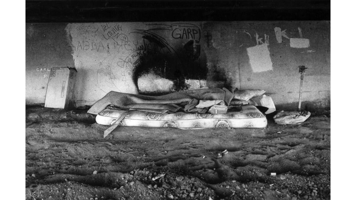 Nov. 8, 1982: Homeless person sleeping on mattress under Sunset Blvd. overpass above the Hollywood Freeway. He didn't want to talk to reporter and photographer.