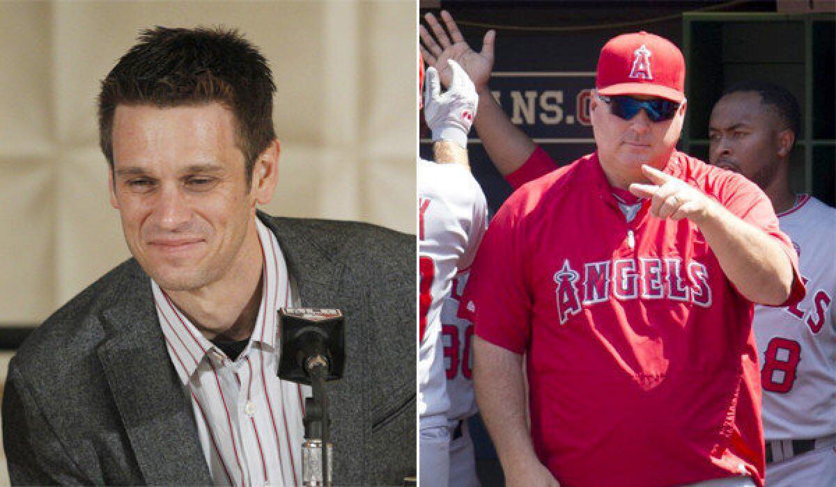 Angels General Manager Jerry Dipoto, left, and Manager Mike Scioscia appear likely to return to their roles with the organization next season despite the team's disappointing 78-84 season, finishing out of the playoffs for the fourth consecutive year.