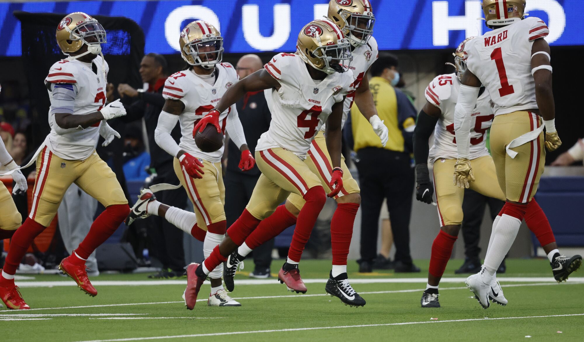 49ers cornerback Emmanuel Moseley reacts with his teammates after intercepting a pass in the second half