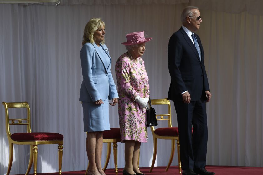 Britain's Queen Elizabeth II stands with US President Joe Biden and First Lady Jill Biden at Windsor Castle on June 13, 2021.