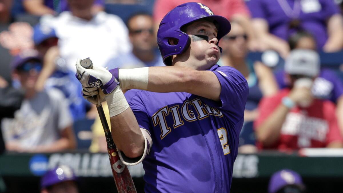 LSU's Michael Papierski follows through on his three-run home run against Oregon State during the second inning Saturday.