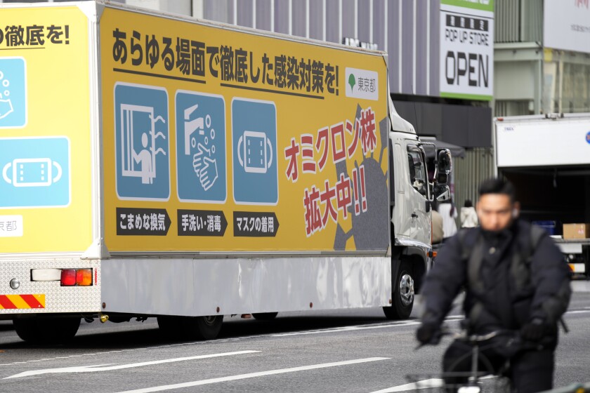 FILE - A truck with a public awareness notice on the omicron coronavirus variant moves though a busy shopping street Friday, Jan. 28, 2022, in Tokyo. Scientists and health officials around the world are keeping their eyes on a descendant of the omicron variant that has been found in more than 50 countries, including the United States. (AP Photo/Eugene Hoshiko, File)