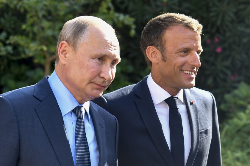 FILE - French President Emmanuel Macron, right, welcomes Russian President Vladimir Putin at the Fort of Bregancon in Bormes-les-Mimosas, southern France, Monday Aug. 19, 2019. Rarely in recent years has the Kremlin been so popular with European visitors. French President Emmanuel Macron arrives Monday, Feb. 7, 2022. The Hungarian prime minister visited last week. And in days to come, the German chancellor will be there, too. (Gerard Julien, Pool via AP, File)
