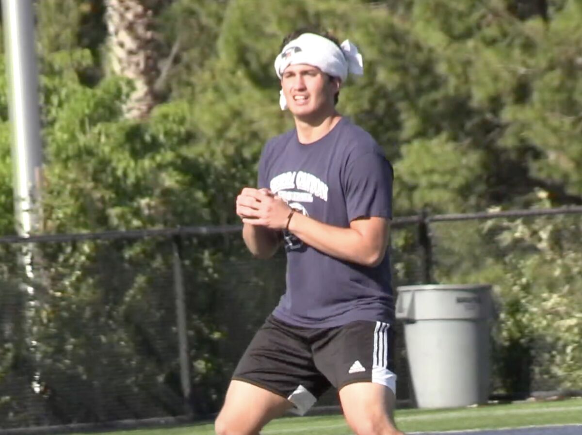Quarterback Chayden Peery of Sierra Canyon practices throwing without a ball last June when balls were not permitted.