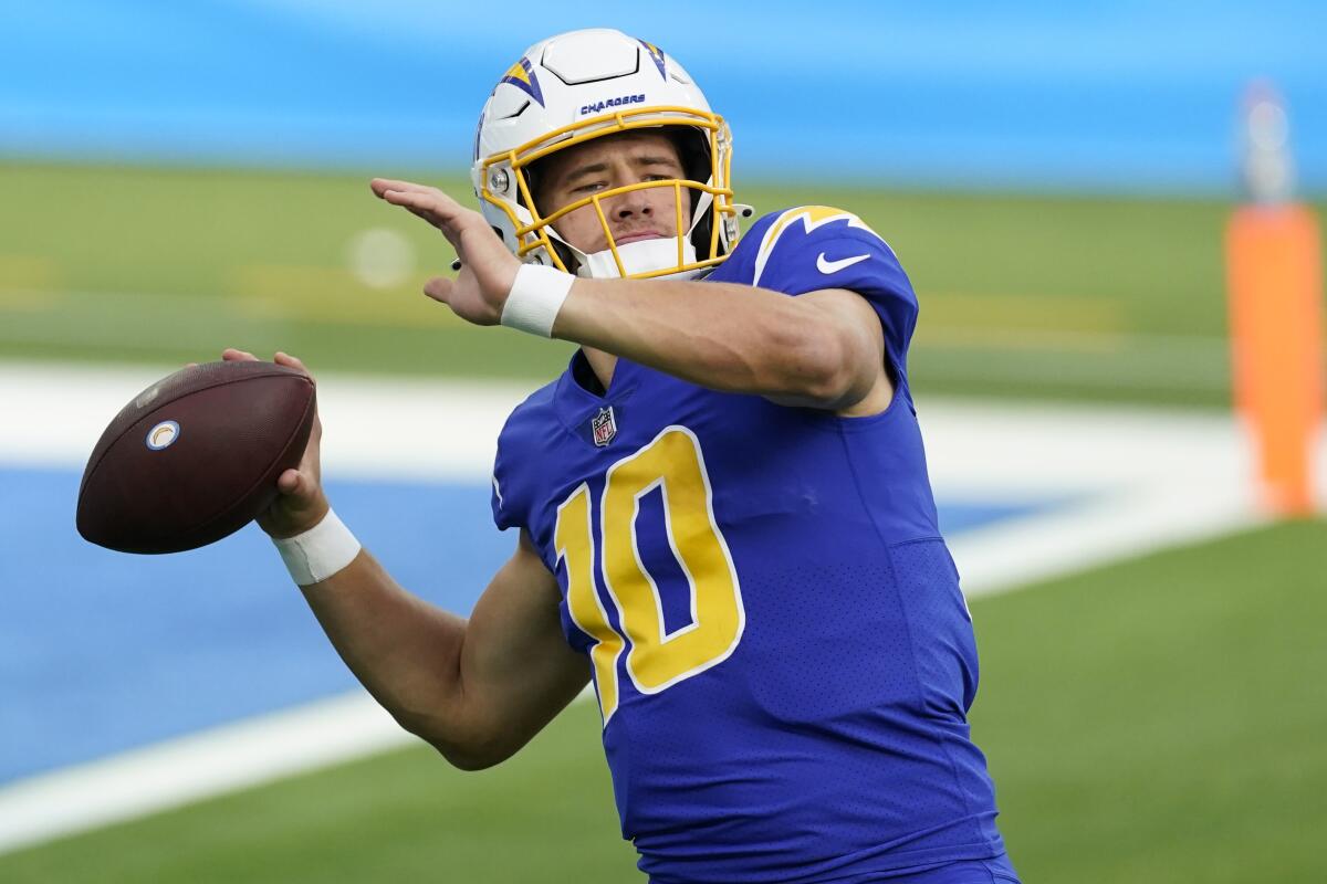 Chargers quarterback Justin Herbert warms up before a game against the Atlanta Falcons on Dec. 13.