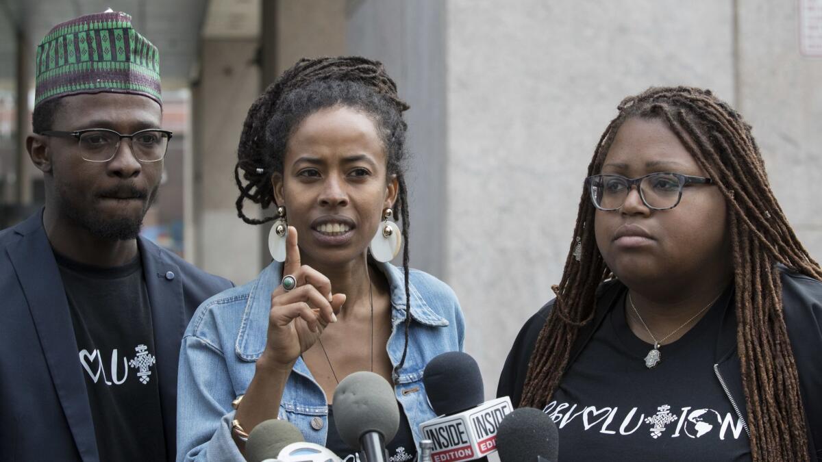Donisha Prendergast, center, is joined by Kelly Fyffe-Marshall, right, and Komi-Oluwa Olafimihan as she speaks during a news conference on Thursday in New York.