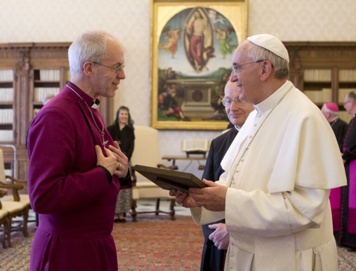 Pope Francis, right, talks with Archbishop of Canterbury Justin Welb on Friday prior to a private audience at the Vatican.