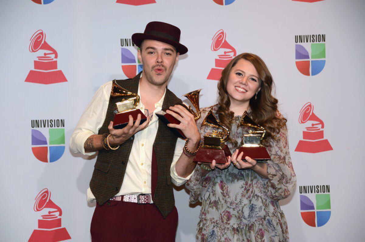 Sibling musicians Jesse and Joy Huerta with their Latin Grammy awards for record of the year, song of the year, contemporary pop vocal album and short form music video.