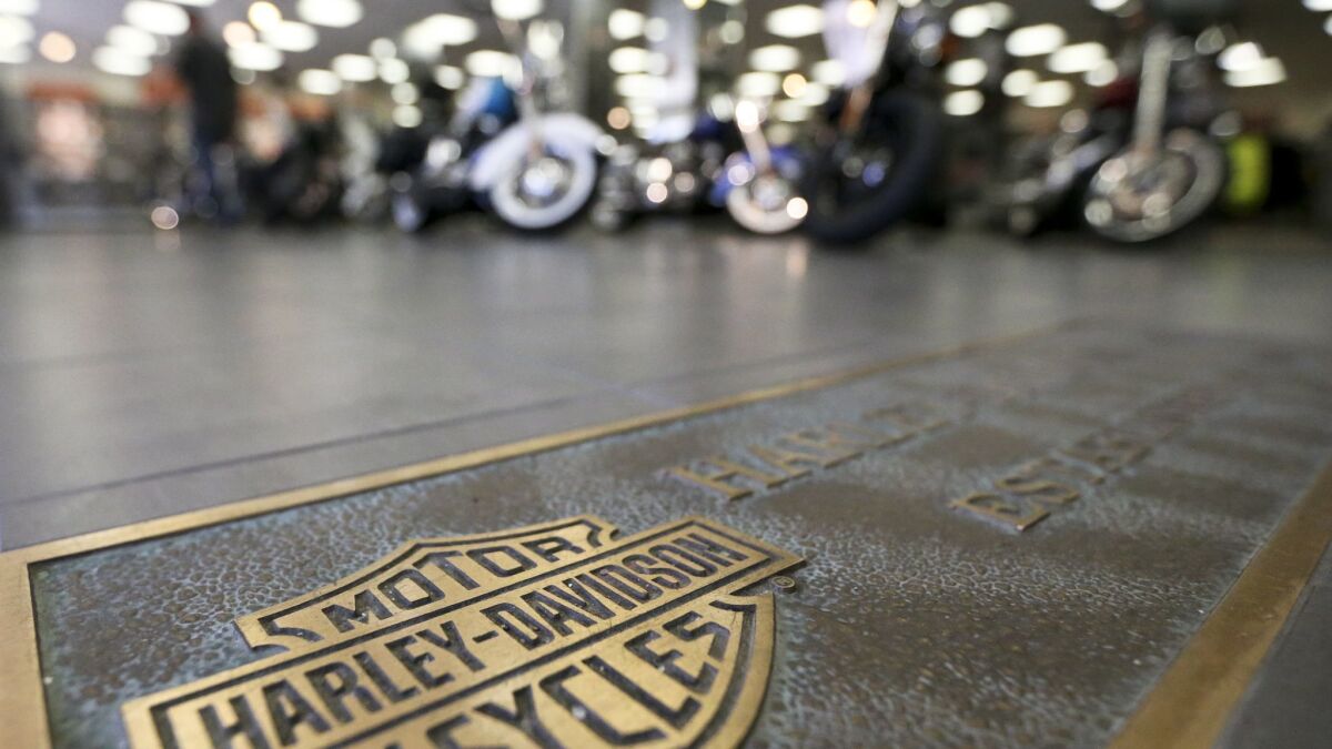Harley-Davidson, facing rising costs from new tariffs, will begin making European Union-bound motorcycles overseas instead of in the United States.