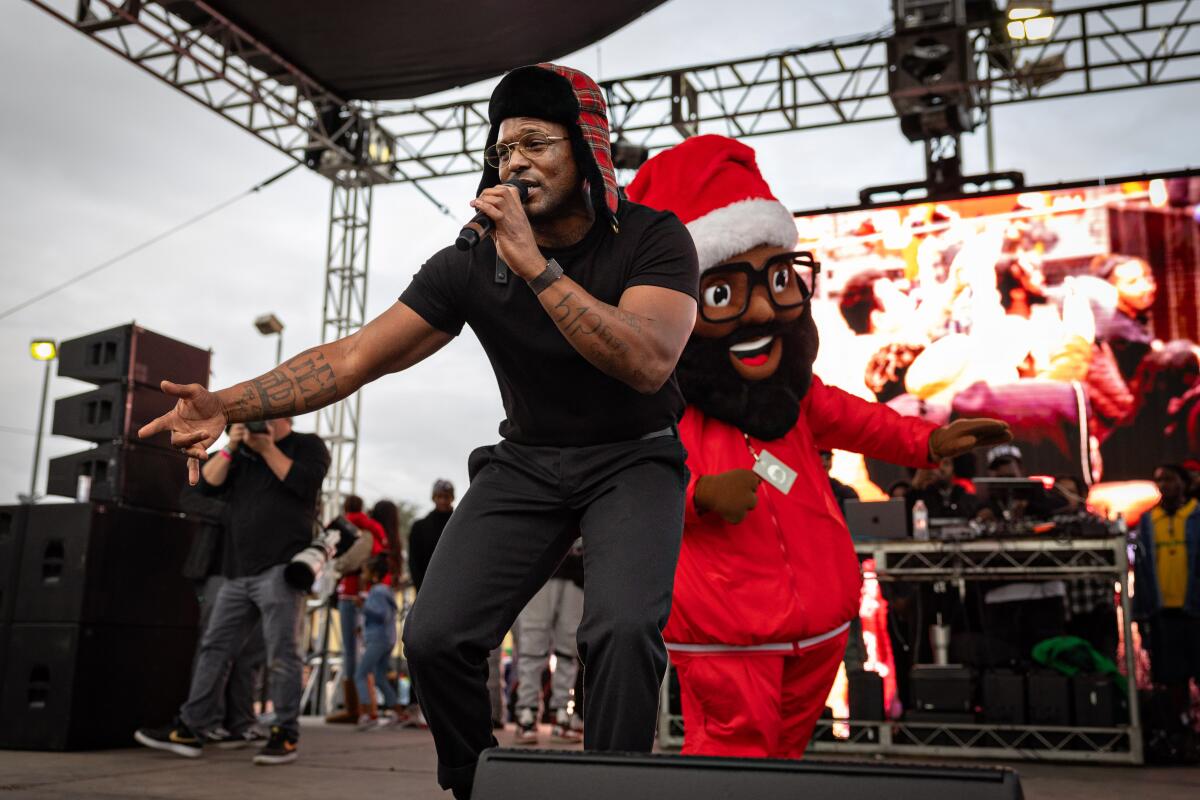 Los Angeles, CA - December 19: SCHOOLBOY Q performs at Top Dawg Entertainment's (TDE) 10th annual toy drive and concert featuring SZA, Jay Rock, YG and other TDE artists in the Nickerson Gardens housing projects on Tuesday, Dec. 19, 2023 in Los Angeles, CA. (Jason Armond / Los Angeles Times)