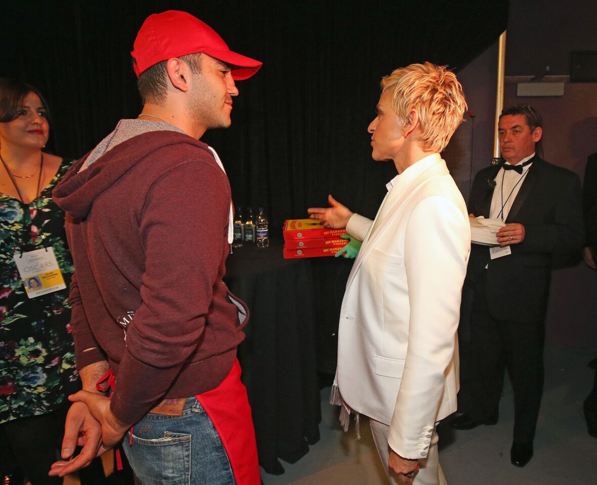 Ellen DeGeneres chats with the pizza deliveryman, Edgar Martirosyan. He's not an actor.