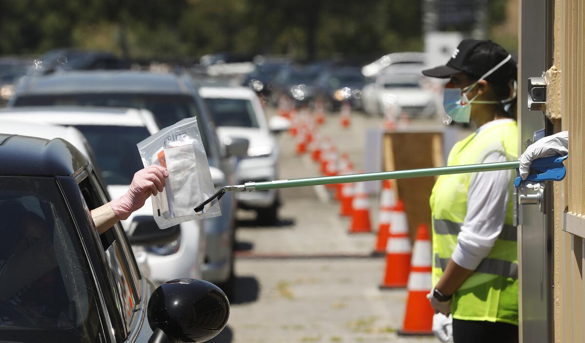 A drive-through testing site at Dodger Stadium in Elysian Park.