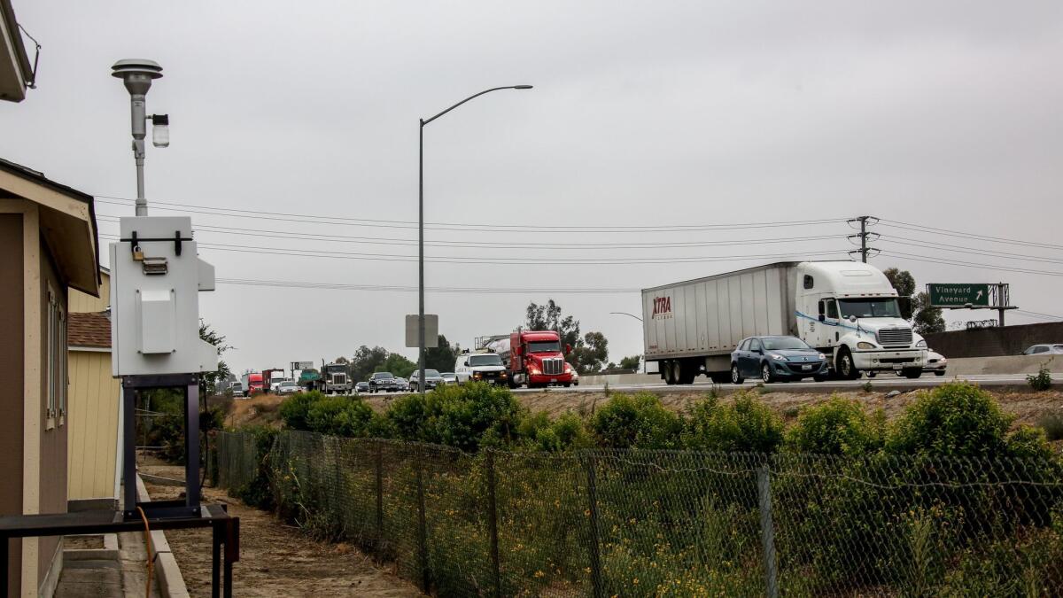 A monitoring device measures air pollution levels along the 60 Freeway in Ontario, Calif.