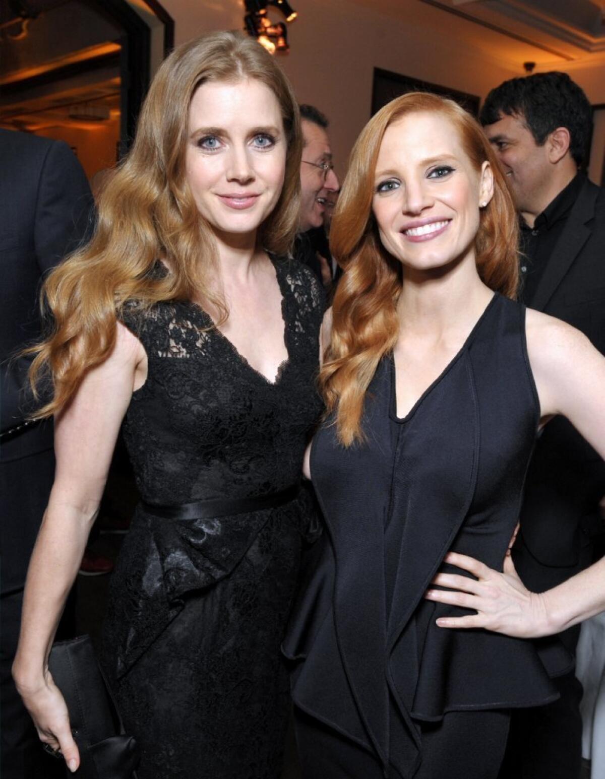 Amy Adams, left, and Jessica Chastain attend the Hollywood Reporter Nominees' Night at Spago on Monday in Beverly Hills.