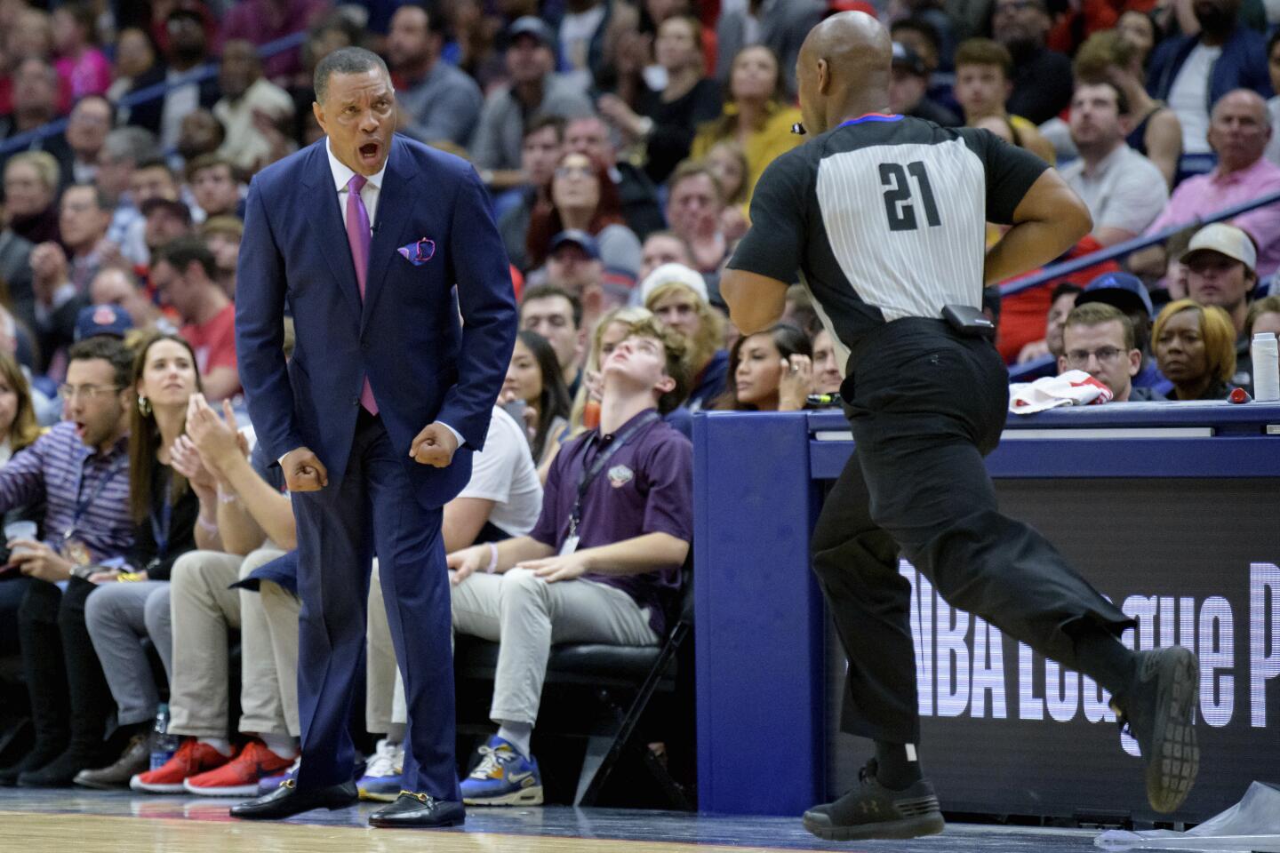 Pelicans coach Alvin Gentry yells at referee Dedric Taylor (21) during the second half of a game Nov. 27 against the Lakers.