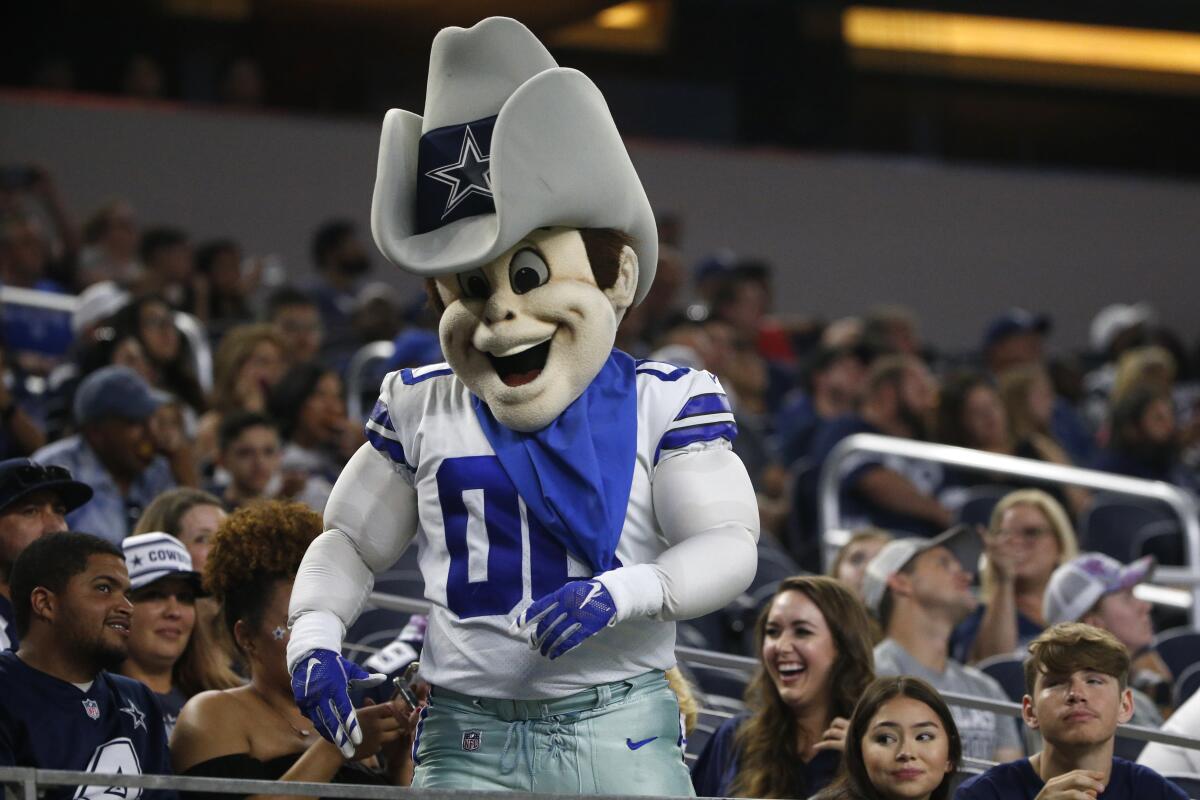 Dallas Cowboys mascot, Rowdy, interacts with fans during a preseason NFL football game