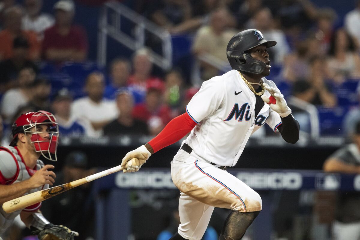 Miami Marlins second baseman Jazz Chisholm Jr. (2) hits during the fourth inning of a baseball game, Sunday, April 17, 2022, in Miami. (AP Photo/Mary Holt)