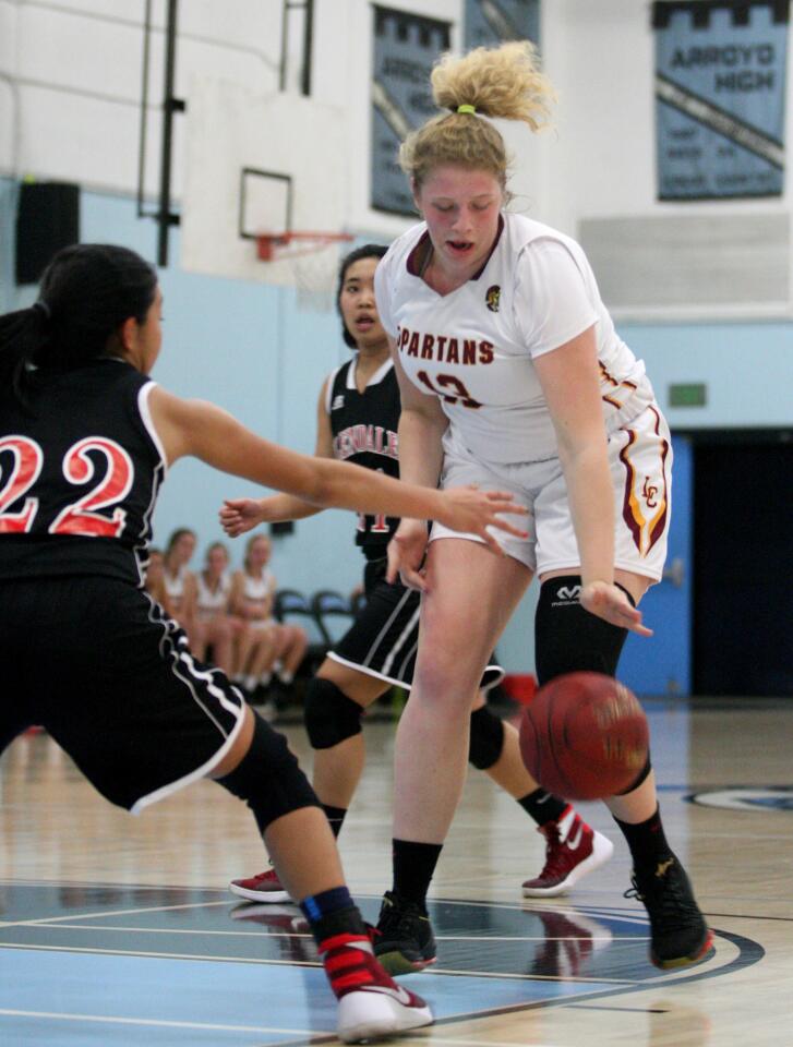 La Cañada High's Amber Graves fights for the ball in a game against Glendale High at Arroyo High School in El Monte on Friday, Dec. 18, 2015.