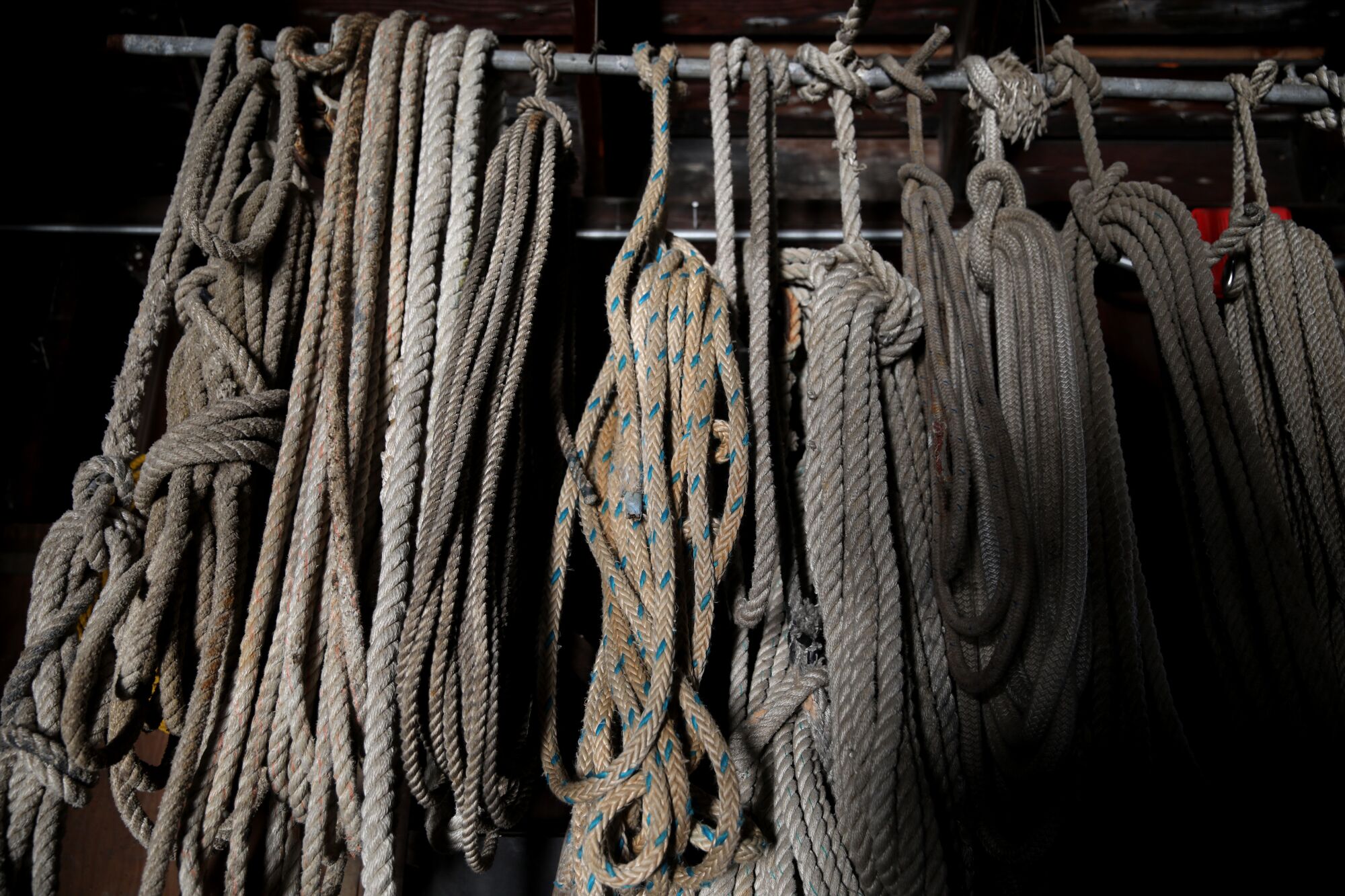training ropes hang in the boat house on the campus.
