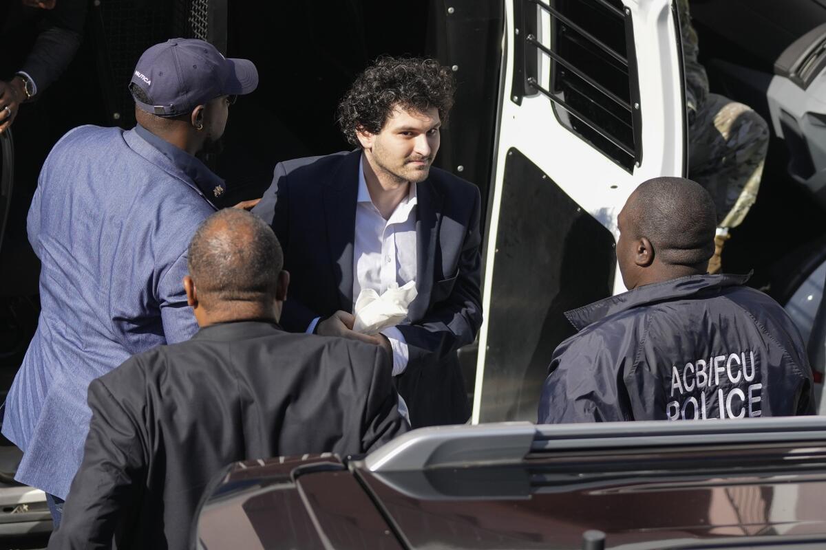 FTX founder Sam Bankman-Fried is escorted from a Corrections Department van