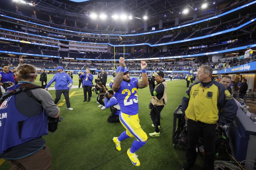 Kyren Williams does a celebratory dance after scoring a Rams TD and tossing the ball to his mom in the stands.