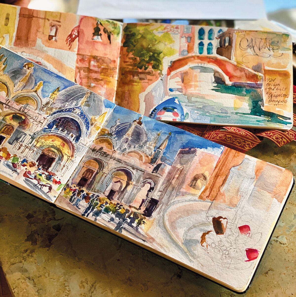 Cherry Sweig’s travel journals are full of her watercolors, which serve as the preliminary versions of the canvassed paintings she created for the show. Cherry Sweig's art exhbit, 'Finding Venetian Angels,' is on display Feb. 28-April 12, 2020 at St. James by-the-Sea Episcopal Church’s Gallery by-the-Sea, 743 Prospect St., La Jolla. The exhibit can be viewed 12:30-3 p.m. Wednesdays, 11 a.m. to 2 p.m. Saturdays, and 8:30-10 a.m. and 11 a.m. to 2 p.m.