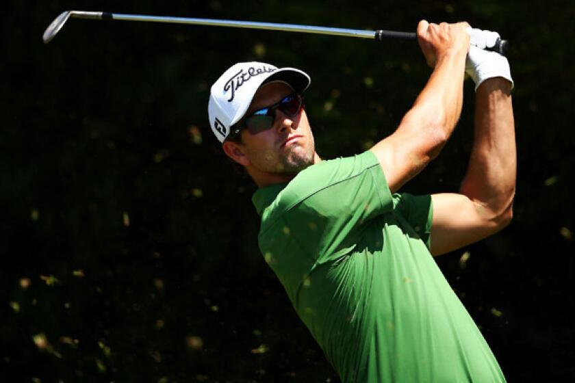 Adam Scott watches his tee shot at No. 6 on Saturday during the third round of the Australian Open. He has a four-shot lead entering the final round.