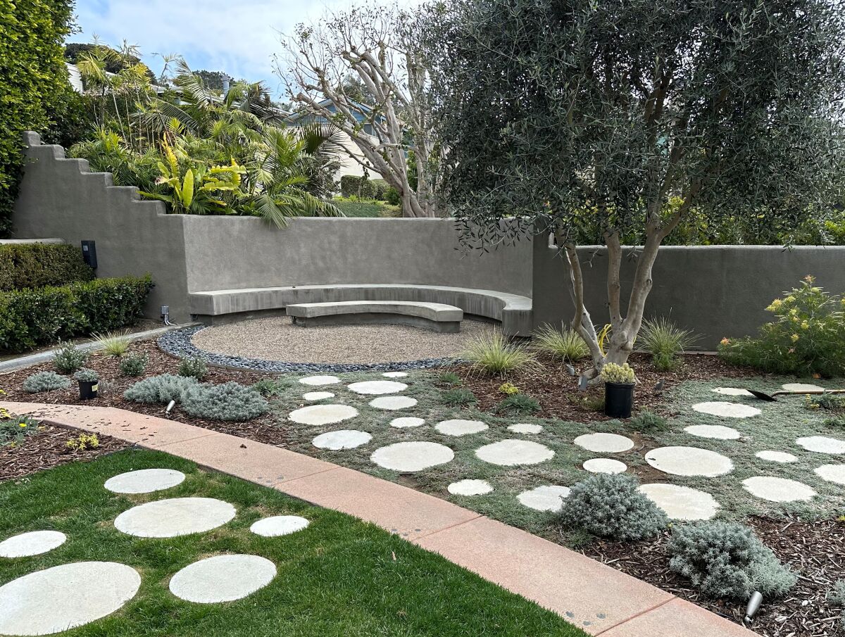 Circular seating and pavers in the aptly named Circle Garden, with design by Andrea Doonan.