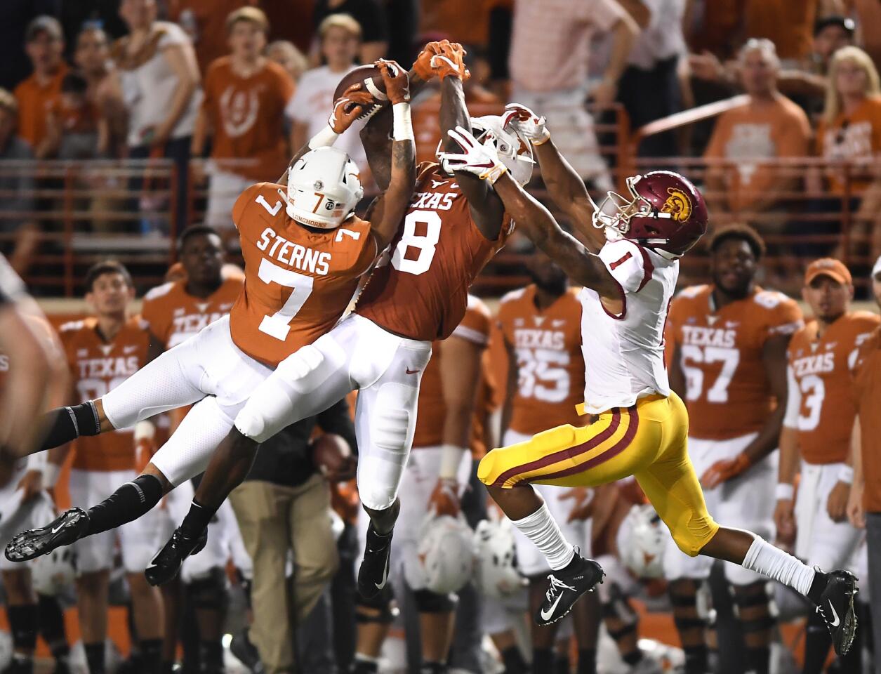 USC receiver Velus Jones can't make the catch as Texas defenders Caden Sterns (7) and Davante Davis defend in the second quarter at Royal-Texas Memorial Stadium on Saturday.