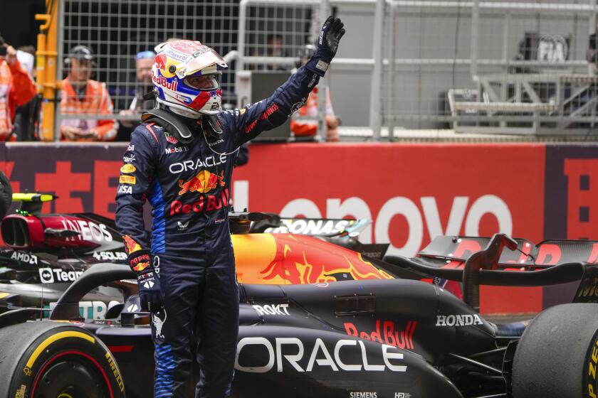 Red Bull driver Max Verstappen of the Netherlands waves after winning the sprint race at the Chinese Formula One Grand Prix at the Shanghai International Circuit, Shanghai, China, Saturday, April 20, 2024. (AP Photo/Andy Wong)