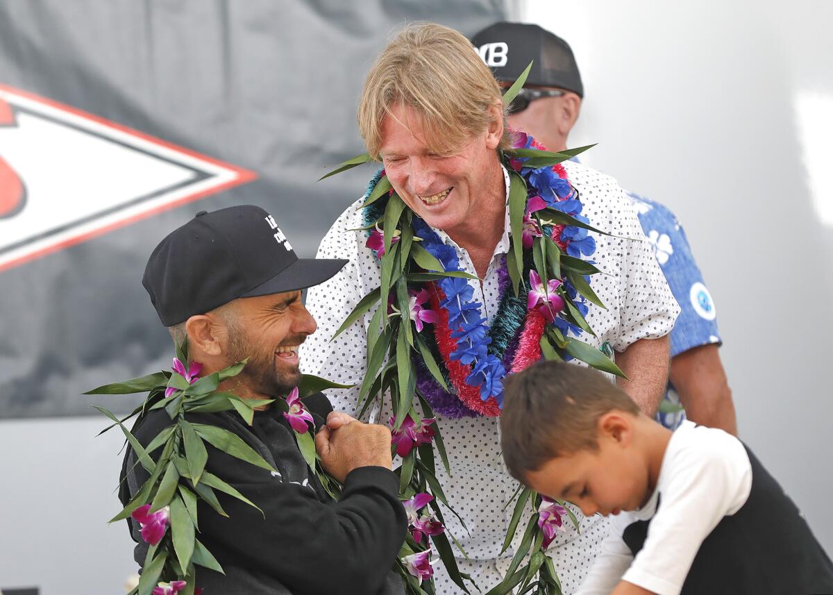 Honor Roll inductee Jesse Billauer and Surf Champion inductee Cheyne Horan, from left, share a laugh.